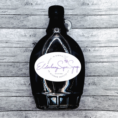 Bottle of Elderberry Super Syrup on a wooden surface